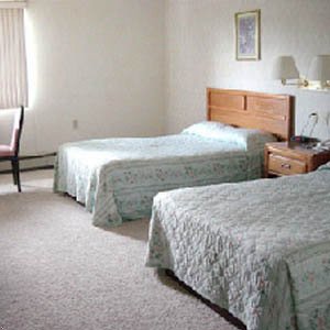 Brass Bell Inn And Suites